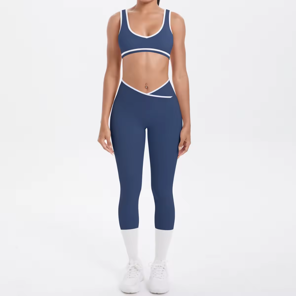 women wearing navy leggings and bra with white trim