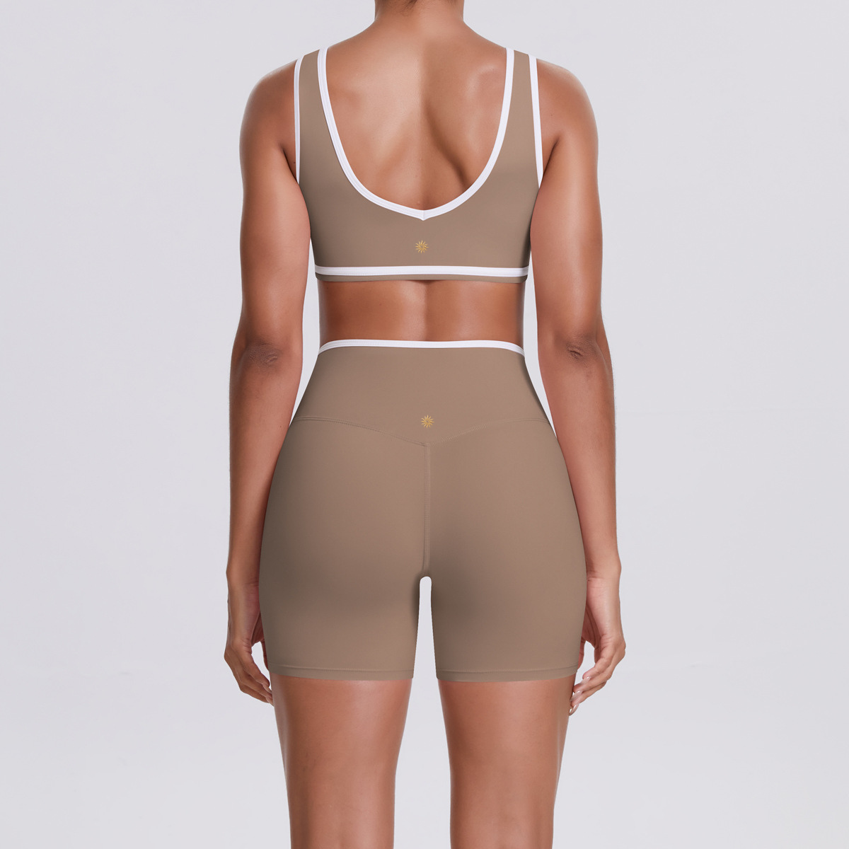 womens beige gym shorts and bra outfit